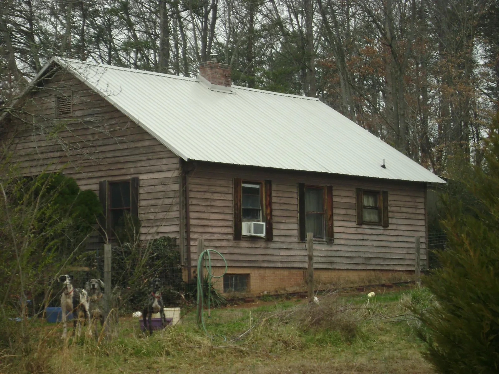 White metal roof on an old wood sided farmhouse in Hanover